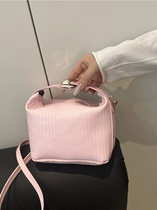 Chic pink textured PU leather handbag with gold metal lock and adjustable shoulder strap