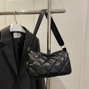 Fashionable black quilted nylon crossbody bag with chic rhombic stitching and adjustable strap