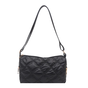 Quilted black nylon crossbody bag with gold hardware and multiple zipper pockets