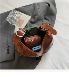 Detailed view of the brown leather saddle bag interior showing practical daily capacity