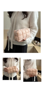 Detailed view of pink puffer makeup bag with square quilting and metal zipper