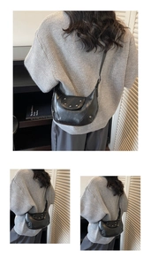 Detail of a black moon saddle bag with silver rivets and textured leather for women
