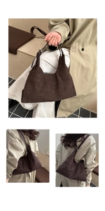 Detailed view of dark brown suede hobo bag featuring adjustable leather strap and matte texture