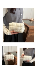 Detail of white quilted puffer cosmetic bag with soft texture and metallic zipper