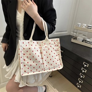 Chic corduroy tote bag with red heart pattern and dual front pockets for women