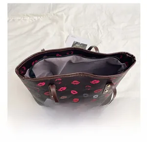 Top view of large printed tote bag interior showing spacious lining and zipper