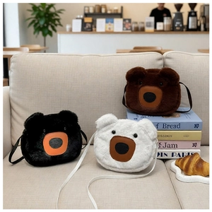 Detailed plush bear-shaped crossbody bags in black, white, and brown with soft fur texture