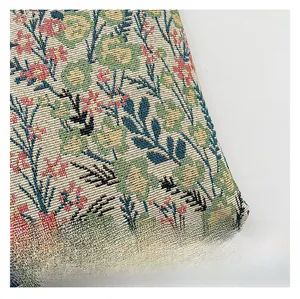 Macro shot of colorful floral jacquard fabric with detailed vintage flower patterns