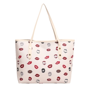 Minimalist cream tote bag with stylish lip print pattern and gold rivet handles