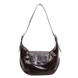 Retro dark brown glossy leather saddle bag with silver studs and curved crescent shape