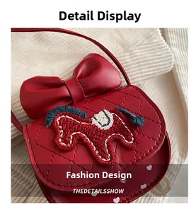 Detail of red quilted mini crossbody bag with a 3D bow and embroidered pony motif