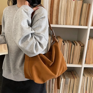Caramel brown vintage tote bag with wide strap for women showing daily commute fashion