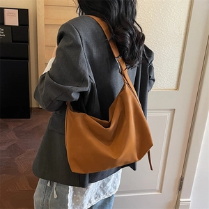 Caramel brown large PU leather hobo bag with wide shoulder strap for women’s casual wear