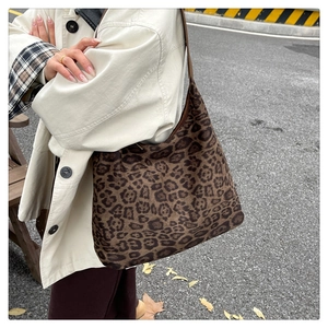 Detail shot of the vintage leopard print tote bag showing texture and spacious hobo design