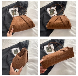Detail view of leopard print cloud bag with pleated textures and slim shoulder strap