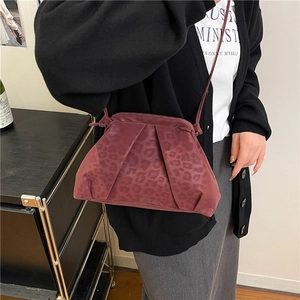 Burgundy leopard print shoulder bag with elegant pleated design and matte suede texture