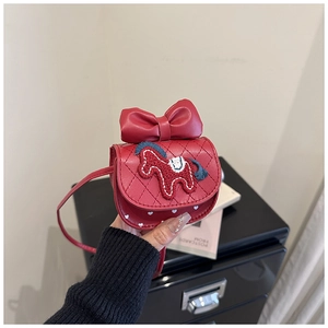 Detail of red crossbody bag with bow, pony embroidery and heart pattern for girls