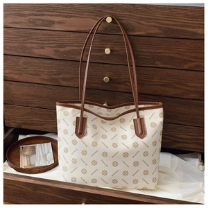 Detail view of large floral print tote bag in cream white and brown vintage styling