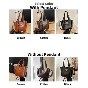 Detail view of vintage tote bags with gold triangle hardware in brown, coffee and black colors