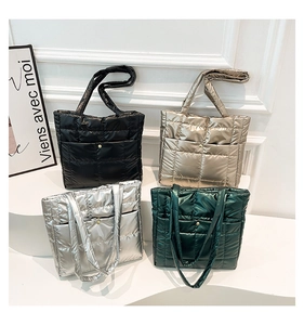 Quilted nylon tote bags in four colors with glossy finish and front snap pocket detail