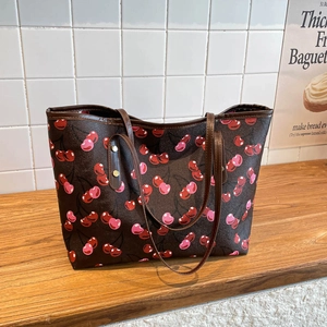 Stylish large capacity tote bag with dark brown leather and red cherry print pattern