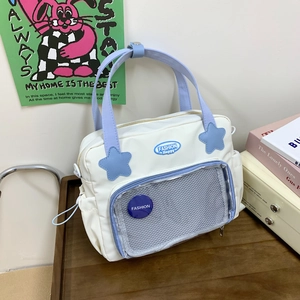 Borsa a mano minimalista crema e blu con stella e tasca a rete per l'uso quotidiano