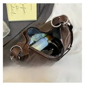 Macro view showing the large internal capacity of the brown faux leather hobo bag