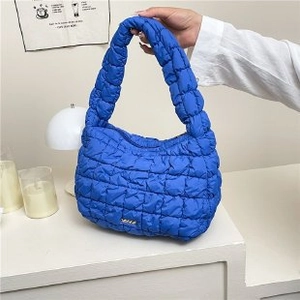 Klein blue quilted bubble handbag with metallic detail and soft nylon texture
