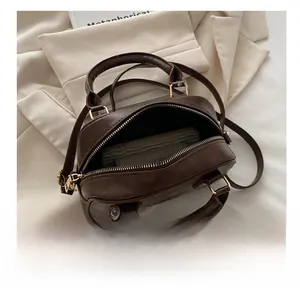 Interior view showing the large storage capacity of this brown retro Boston bag