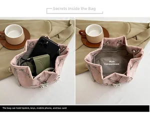 Détails de l'intérieur du sac seau plissé rose montrant la capacité pour le téléphone