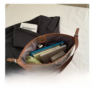Interior detail of leopard print tote bag showing large capacity for laptop and daily items