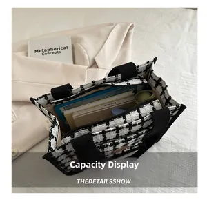 Spacious interior of plaid tote bag showing storage for tablet, books and essentials