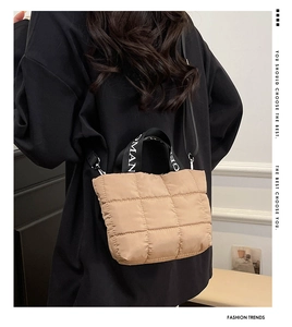 Rear view of khaki quilted crossbody bag with stylish letter-print straps and metal hardware