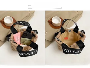 Internal view of brown quilted tote bag showing storage space for phone and essentials