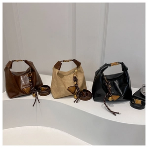 Minimalist vintage shoulder bags in dark brown, khaki, and black with metal logo detail