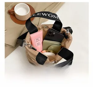 Internal view of khaki quilted tote bag showing large capacity for essentials