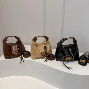 Retro half-moon crossbody bags in brown, beige and black with metal triangle plaque