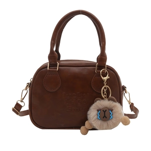 Retro brown leather-style square tote bag with logo embossing and plush keychain charm