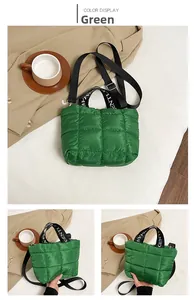 Detail of green quilted puffer bag with signature embroidery and lettered web handles