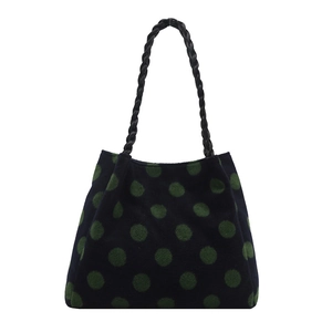 Winter faux fur tote bag with dark green polka dots and black woven leather handles