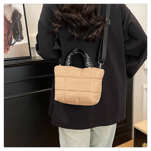 Quilted khaki crossbody bag with padded nylon texture and GENT MAN webbing handles