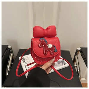 Detail of red girls purse with 3D bow, pony embroidery and white heart pattern