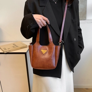 Brown vintage faux leather tote bag with triangle logo and detachable shoulder strap