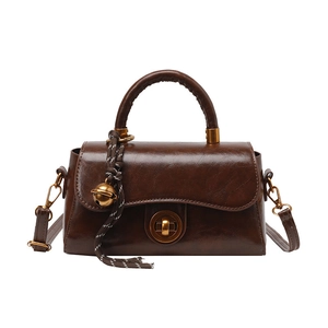 Retro dark brown top-handle bag with gold metal clasp and detachable shoulder strap