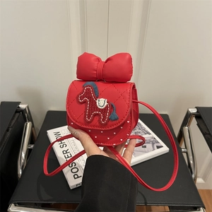 Red girls crossbody bag with large bow and horse embroidery for Lunar New Year