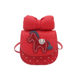 Red girls' crossbody bag with quilted bow and embroidered horse on a heart pattern