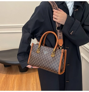 Detail view of brown vintage monogram tote bag with wide strap and JIPIN logo