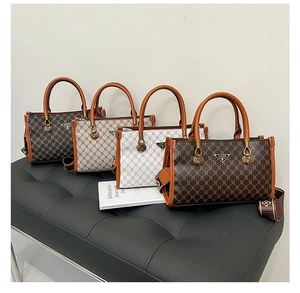 Detail view of stylish tote bags in four colors with textured patterns and wide straps