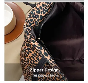 Macro detail of leopard print tote bag zipper closure with dark brown silk lining