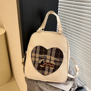 Vintage cream cartoon puppy backpack with plaid lining and dog embroidery under light